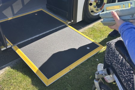 Mosgiel Bus Ramp lowered onto grass slope for boarding